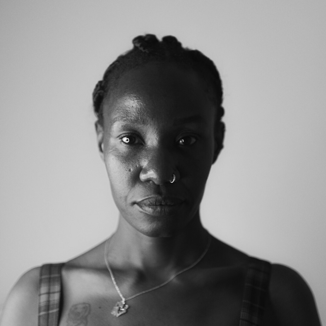 Portrait of a South African woman, editorial director, smiling in a studio