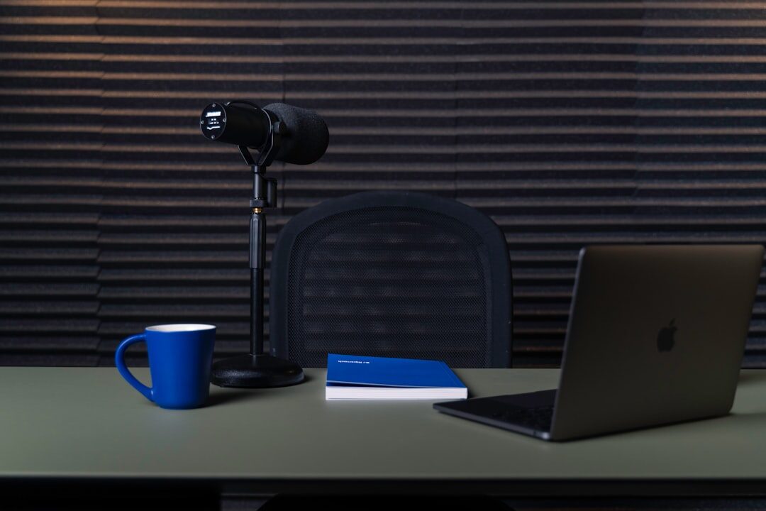 Wide view of a modern podcast recording studio with acoustic panelling