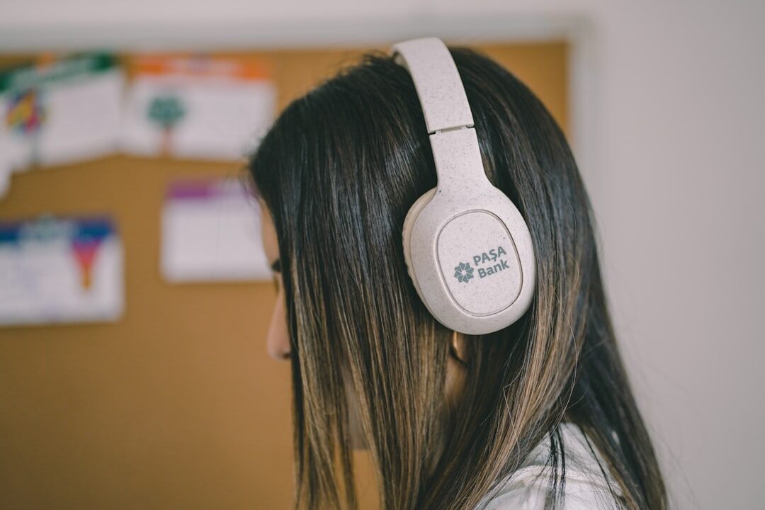person listening to podcast on headphones